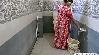 Elderly Indian lady struggles with peeing and gets a helping hand.