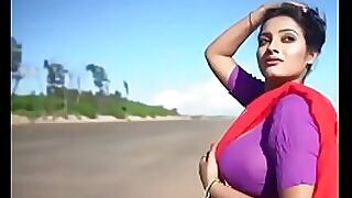 Indian beauty gets wild and wet on a sandy beach in HD.