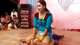 Busty teen dances provocatively in a Telugu-themed porn video.