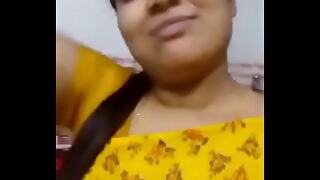 Desi Indian aunty gets naughty in a hot Tamil XXX video, showcasing her mature beauty and insatiable desires.